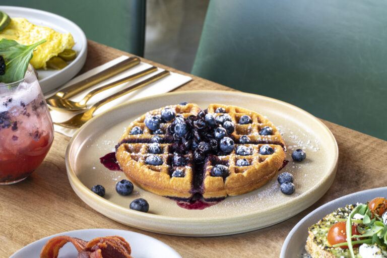 Belgium waffle topped with blueberries served at Early Birds, the best Belgian waffle breakfast in Las Vegas